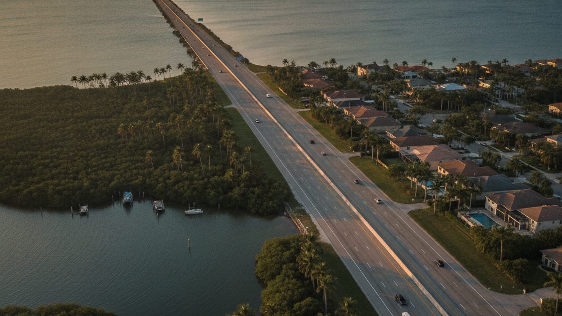 Aerial view of Tampa Bay freeway network at golden hour showing coastal Clearwater through inland Tampa to east-county Brandon