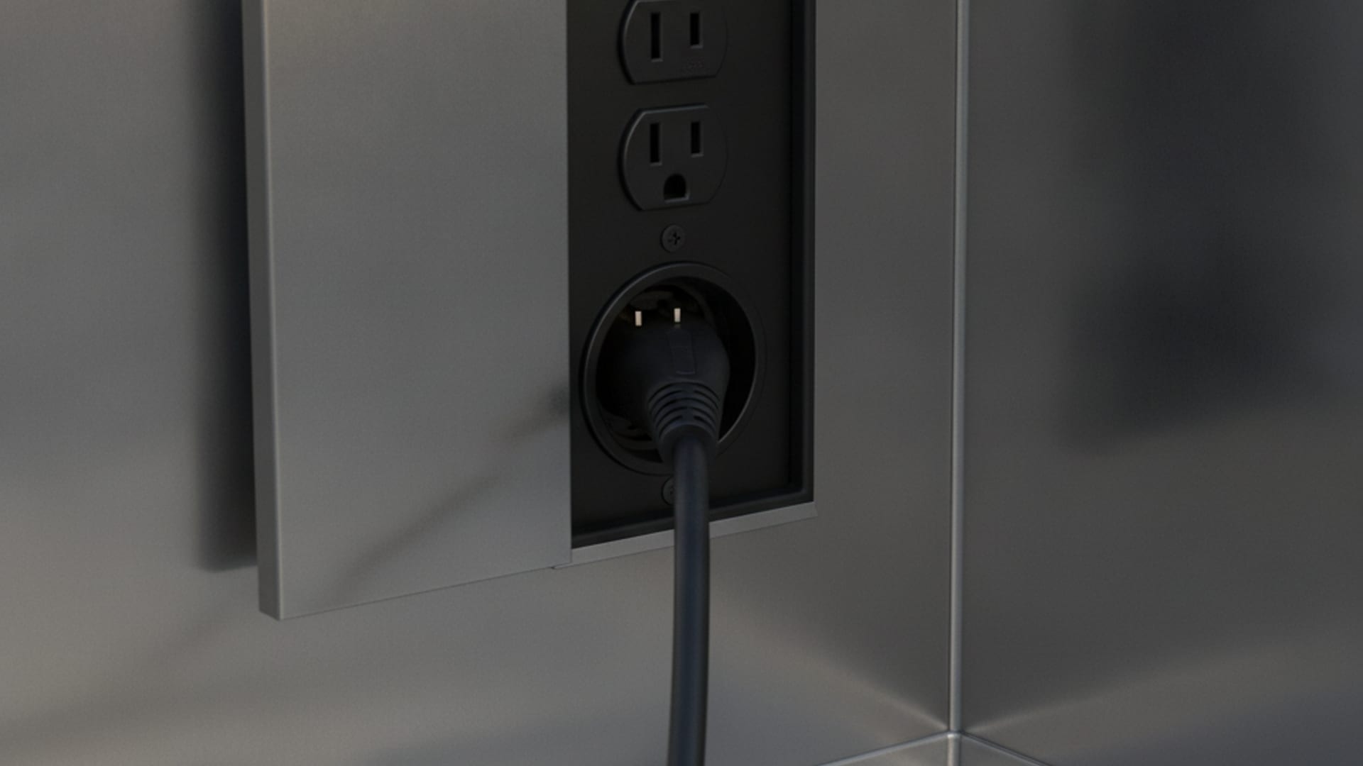 Mobile charging cable connected to a Tesla Model Y on a Tampa Bay street